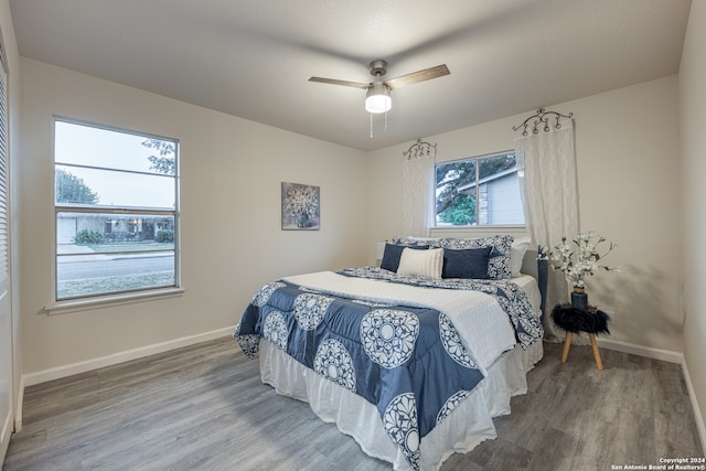 bedroom featuring ceiling fan and hardwood / wood-style floors