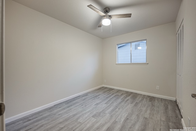 unfurnished bedroom with ceiling fan and hardwood / wood-style floors