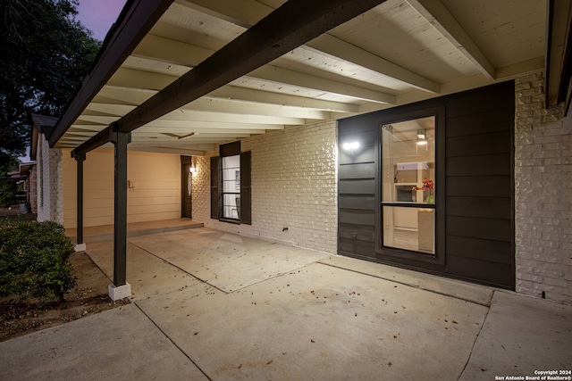 view of exterior entry at dusk