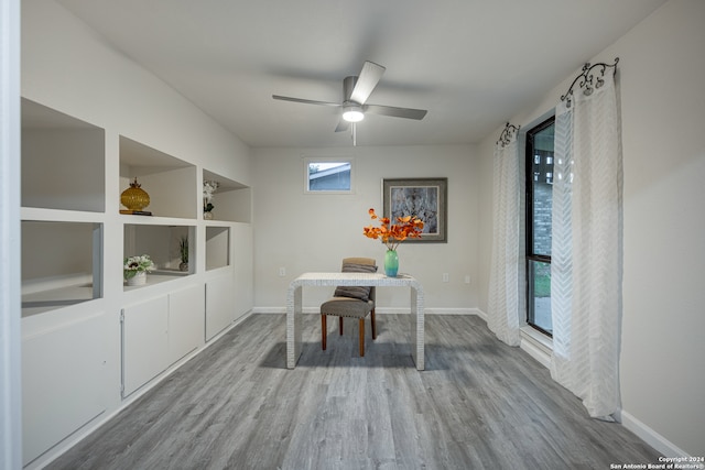 dining area featuring ceiling fan, a wealth of natural light, and wood-type flooring