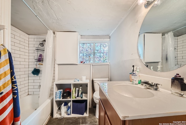 full bathroom with tile patterned floors, shower / bath combo with shower curtain, vanity, and toilet