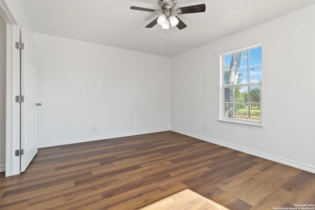 empty room with hardwood / wood-style floors, ceiling fan, and a textured ceiling