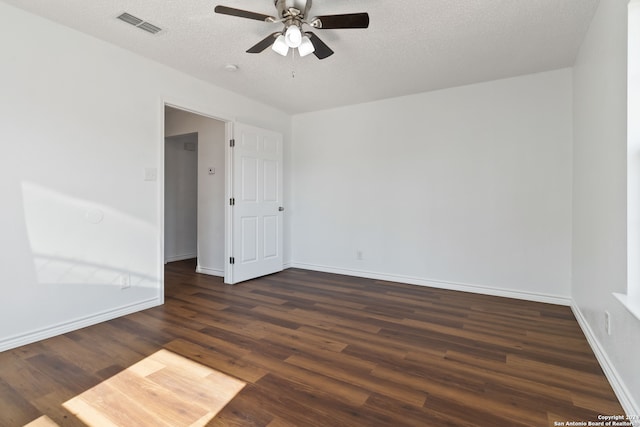 spare room featuring ceiling fan, wood-type flooring, and a textured ceiling