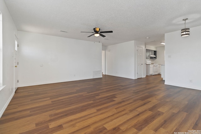 unfurnished living room with ceiling fan, a textured ceiling, and dark hardwood / wood-style floors