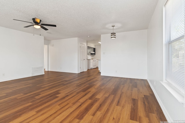 unfurnished room with hardwood / wood-style floors, ceiling fan, and a textured ceiling