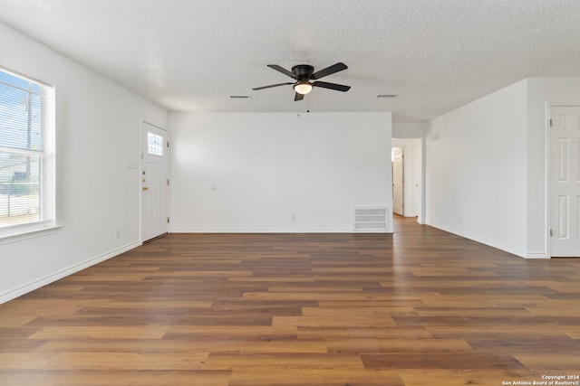 spare room featuring ceiling fan, a textured ceiling, and wood-type flooring