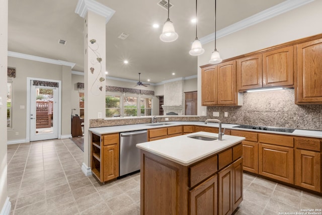 kitchen with ornamental molding, sink, stainless steel dishwasher, a kitchen island with sink, and cooktop