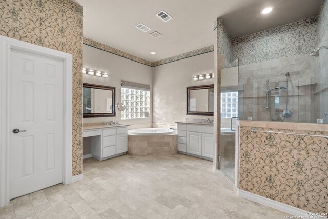 bathroom featuring vanity and shower with separate bathtub