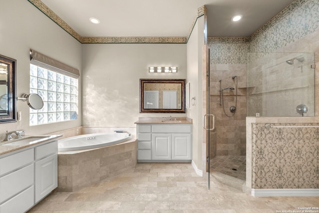 bathroom featuring independent shower and bath and vanity