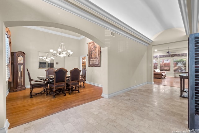 dining space featuring ceiling fan with notable chandelier, light wood-type flooring, and ornamental molding