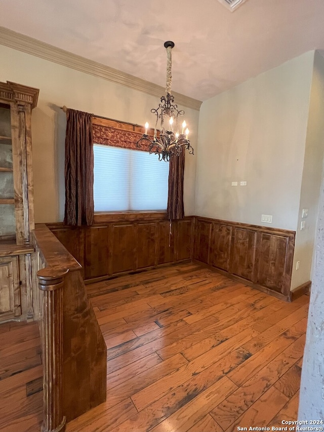 interior space with a chandelier and hardwood / wood-style flooring