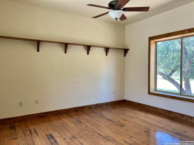 empty room featuring ceiling fan and light wood-type flooring