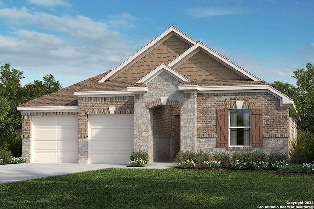 view of front of home featuring a front yard and a garage