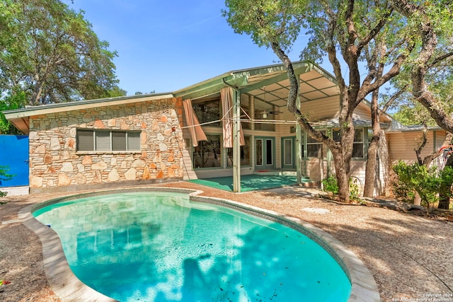 view of swimming pool with a patio