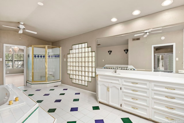 full bathroom featuring ceiling fan, visible vents, vanity, vaulted ceiling, and a stall shower