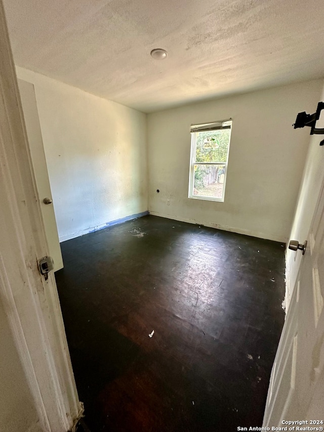 empty room with a textured ceiling