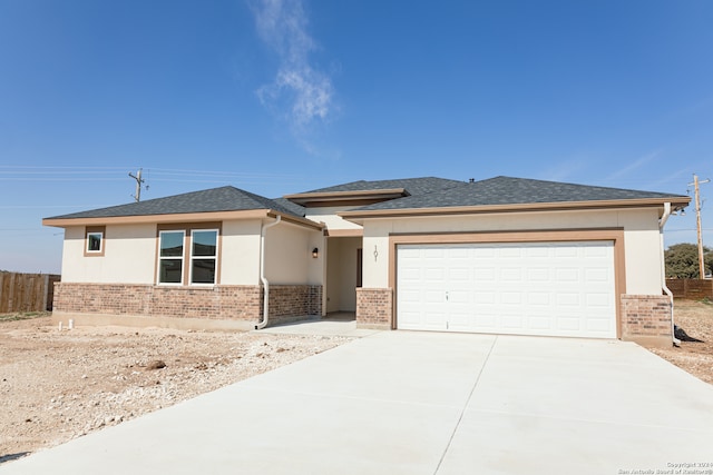 prairie-style house featuring a garage