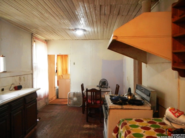 kitchen featuring wood ceiling, plenty of natural light, range with electric cooktop, and dark hardwood / wood-style flooring