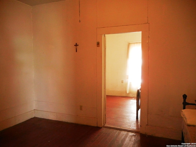 spare room with dark hardwood / wood-style flooring