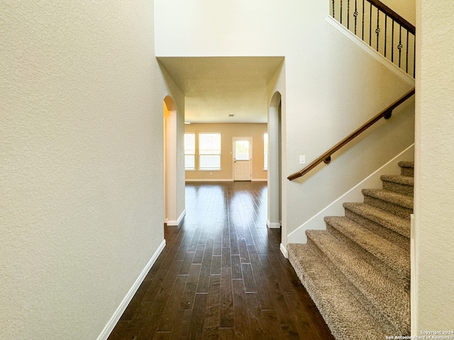 hall with hardwood / wood-style flooring