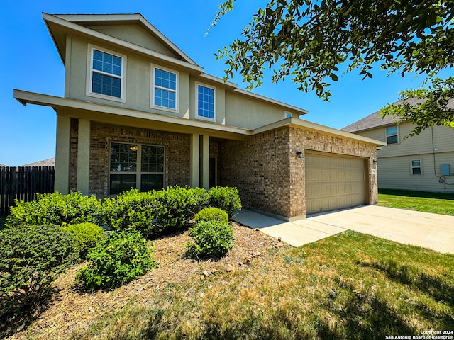 view of front facade with a front lawn and a garage