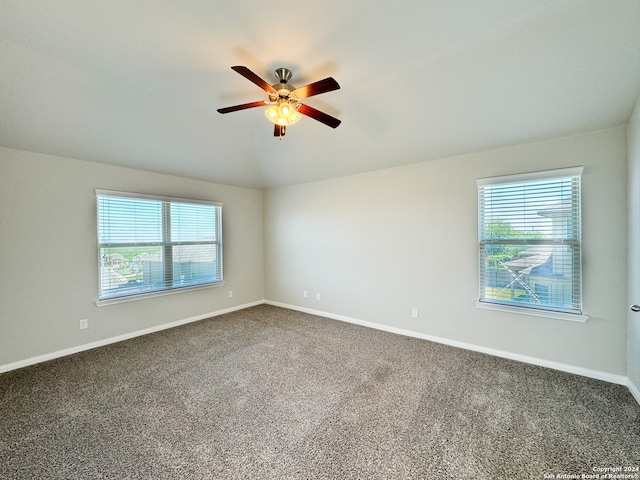 empty room featuring ceiling fan and carpet floors