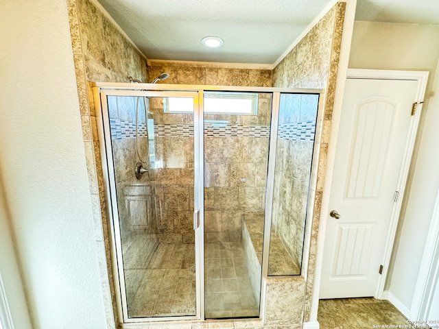 bathroom featuring tile patterned floors and walk in shower