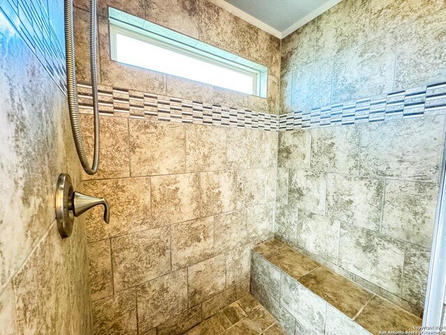 bathroom featuring tiled shower