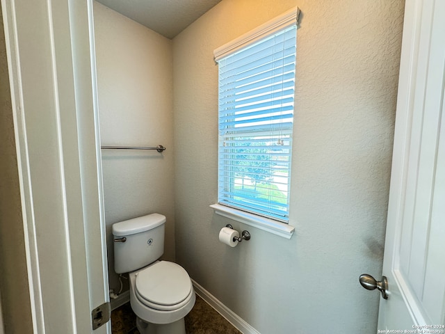 bathroom with tile patterned floors and toilet