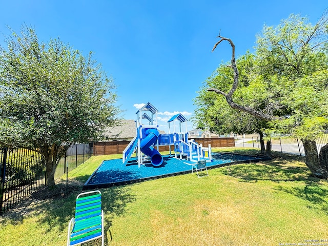 view of jungle gym with a yard