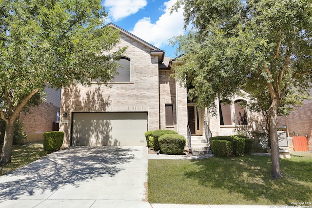 view of front of house featuring a garage and a front yard