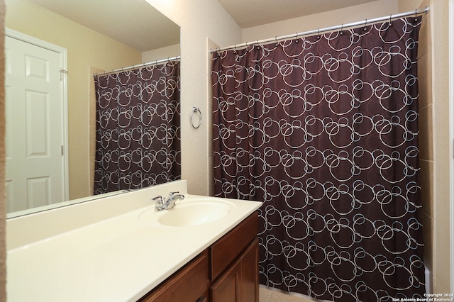 bathroom featuring vanity and a textured ceiling