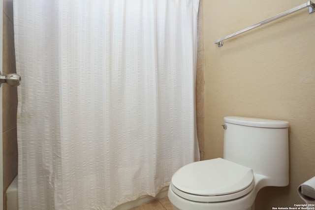 bathroom featuring tile patterned floors and toilet