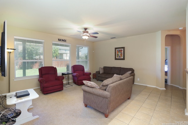 living room with ceiling fan and light tile patterned flooring