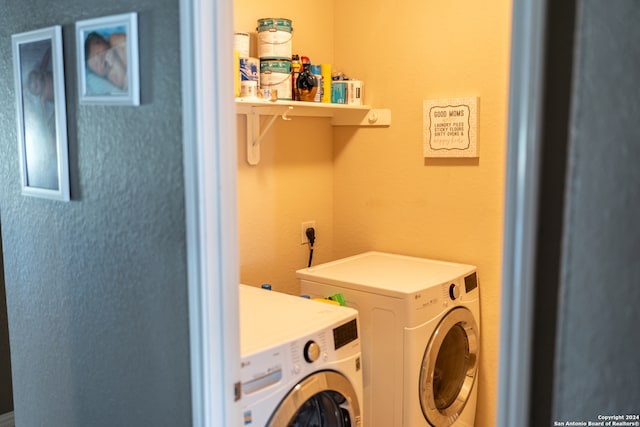 clothes washing area featuring washing machine and dryer