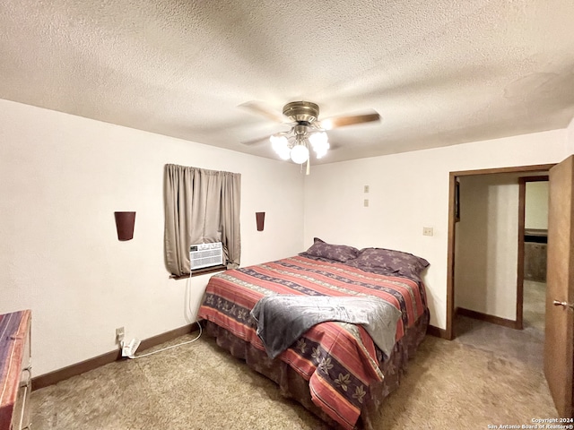 carpeted bedroom featuring cooling unit, a textured ceiling, and ceiling fan