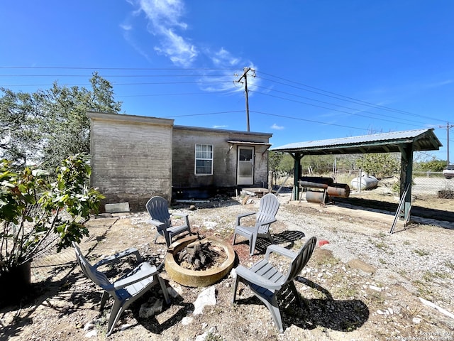 view of patio / terrace with a fire pit