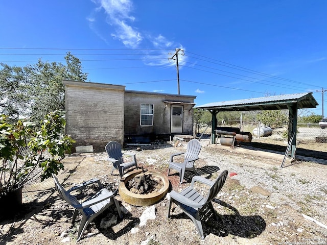 view of patio with a fire pit