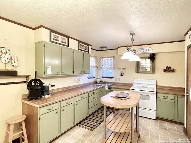 kitchen featuring pendant lighting, ornamental molding, green cabinetry, a textured ceiling, and electric stove