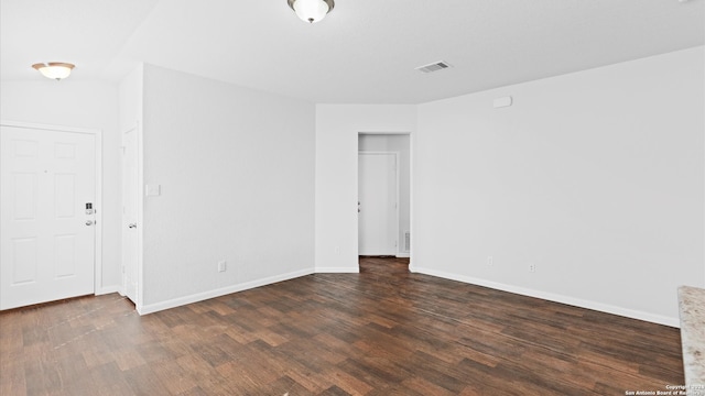 unfurnished room with wood-type flooring