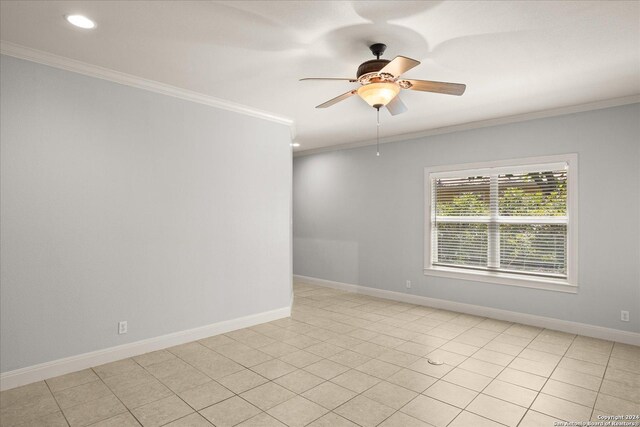 tiled spare room featuring ceiling fan and crown molding