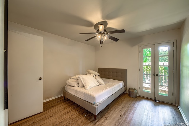 unfurnished bedroom featuring ceiling fan, light hardwood / wood-style flooring, french doors, and access to exterior