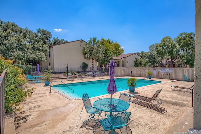 view of swimming pool with a patio area