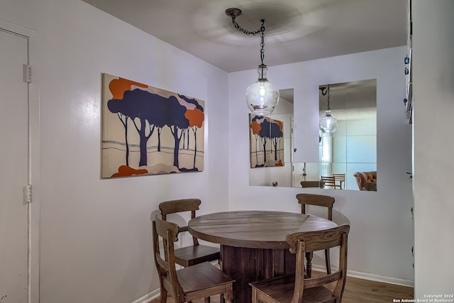 dining area with hardwood / wood-style flooring