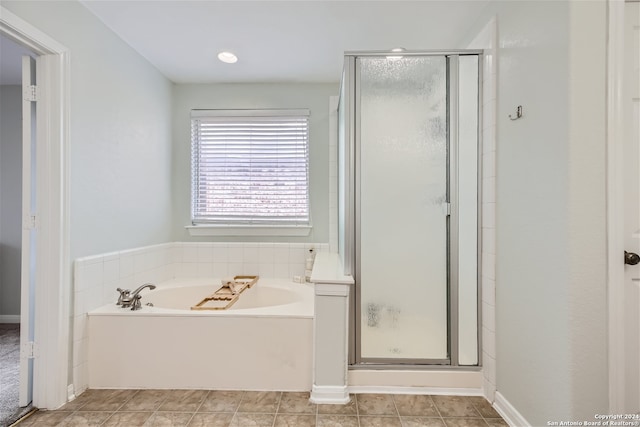 bathroom with tile patterned flooring and plus walk in shower