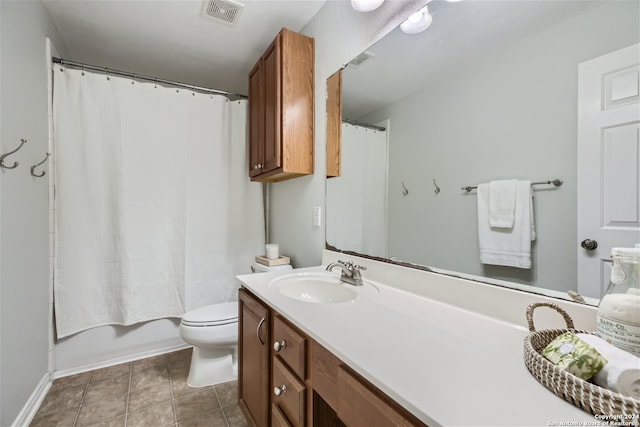full bathroom featuring tile patterned flooring, visible vents, vanity, and toilet