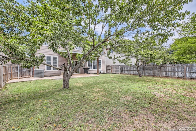 view of yard featuring central AC, a patio area, and a fenced backyard
