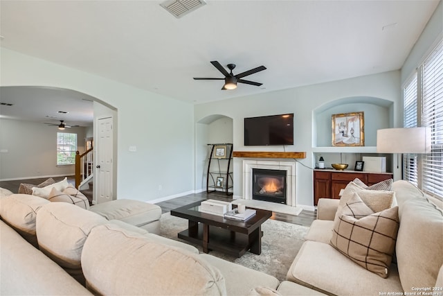 living room with ceiling fan and light hardwood / wood-style floors