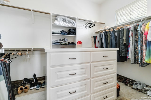 spacious closet featuring light tile patterned flooring