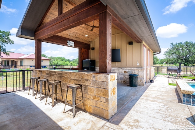 view of patio with exterior bar